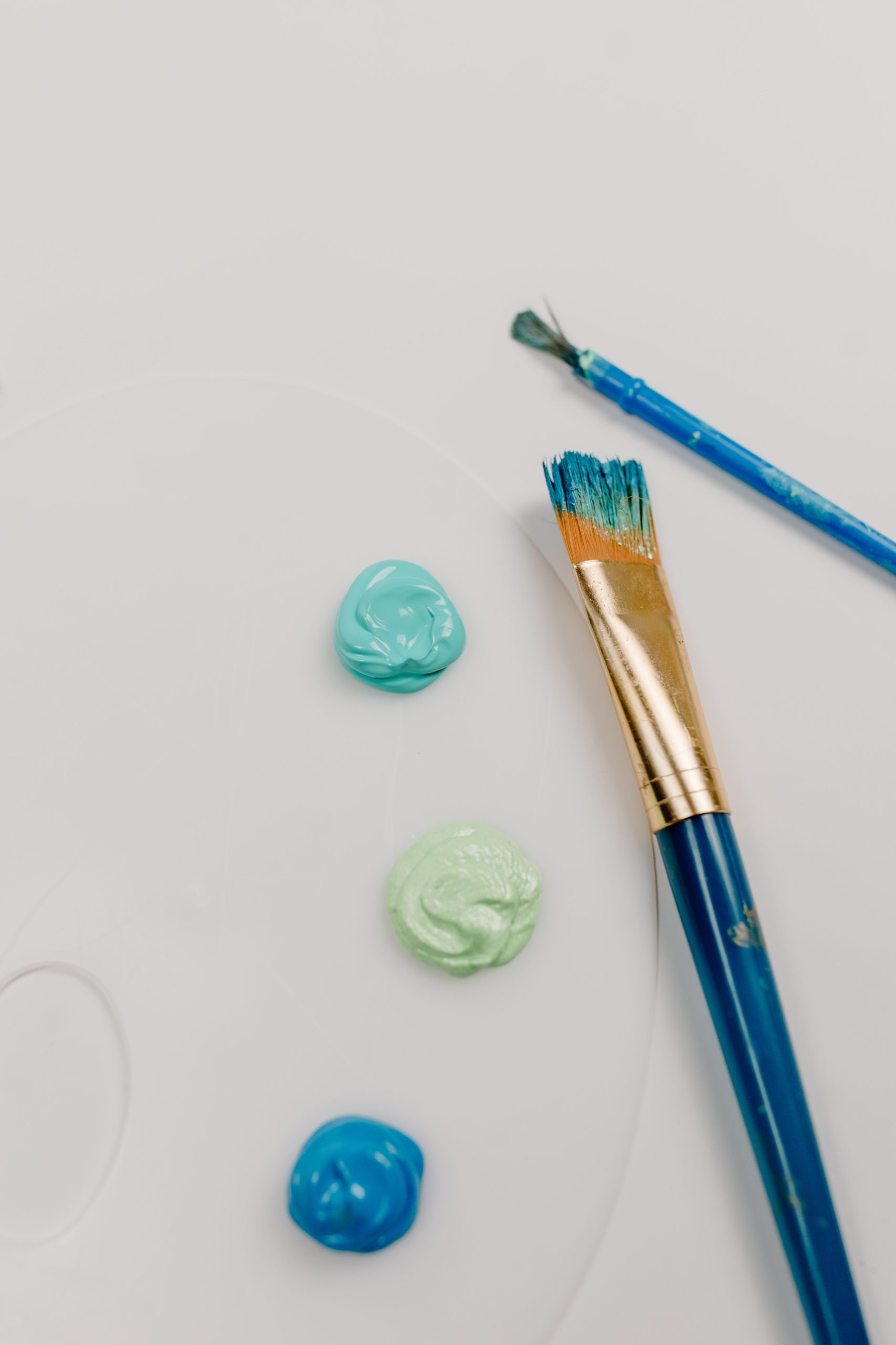 blue paint and paint brush
